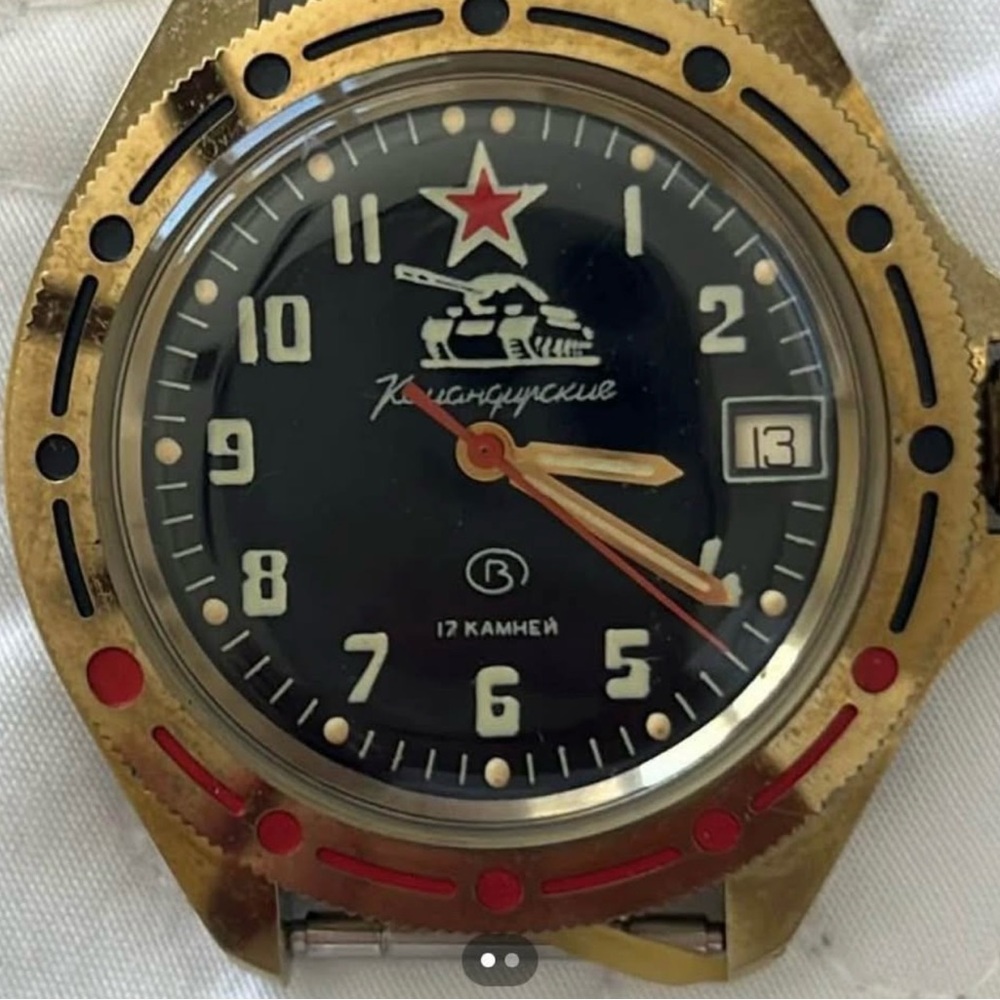 Vintage Gold and Black Watch with Red Accents